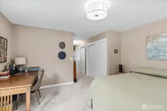 Primary Suite includes a half bath with new sliding door and storage shelf