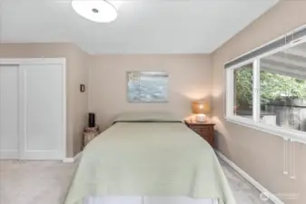Primary Suite includes a half bath with new sliding door and storage shelf