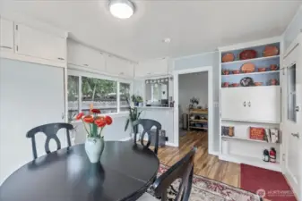 Dining area/ Laundry space.Versatile Built-ins: Extra storage and display space with classic 1940s character.