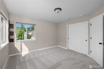 Deep closets in bedroom and bathroom offer plenty of storage space.