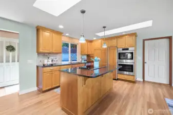 Beautiful tile backsplash adds style and function—carrying up to surround the window for a seamless look.