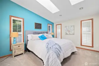Main-level primary suite offers the perfect blend of privacy and luxury