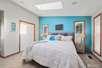 Natural light pours in through skylights and oversized windows, creating a warm and inviting ambiance.