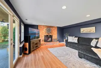 Daylight lower level with second ensuite, separate living area, fireplace, and patio—ideal for multi-generational living.