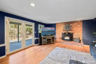 Brick surround fireplace creates a stunning accent wall full of warmth and character.