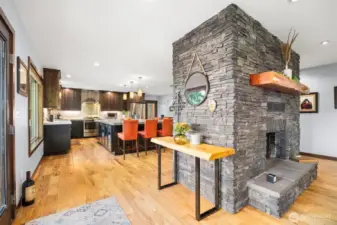 Beautiful custom double sided fireplace greets you  as you enter this beautiful home .