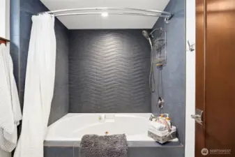Downstairs custom tiled bath.