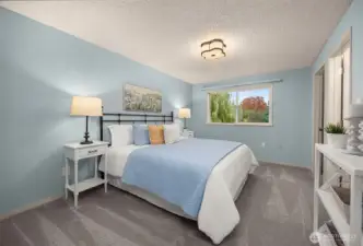 Large primary suite with walk in closet and attached full bath.