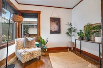 Whether you're dreaming of a writing nook, art studio, or cozy reading room, this main-floor sun-filled den delivers. Fresh paint, gleaming hardwoods, picture rails, and fully-cased, wood-wrapped windows highlight the craftsmanship found throughout this incredible home.