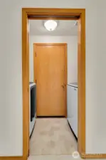 Utility room off garage with washer and dryer