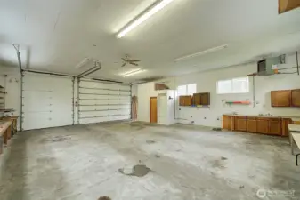 Cabinets, shelving, tools and equipment remain with shop.