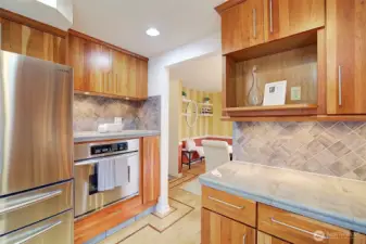 The niche above the stove is the perfect place for a coffee bar. A built in microwave shelf is also featured.
