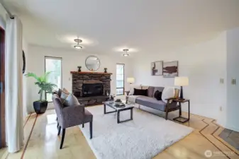 The family room features a cozy fireplace - offering a warm and inviting place to relax.