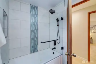 The hall bath has been updated and offers crisp and clean finishes. Isn't it great?