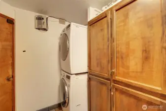 The laundry room is featured on the main floor and offers additional storage cabinets.  The stackable washer and dryer are included with your purchase.