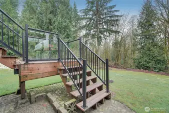 Stairs are finished custom materials to match the decking with medal handrails.