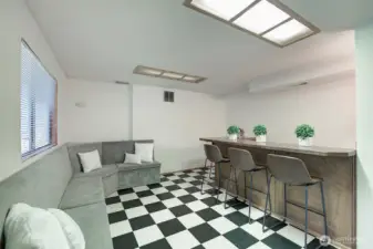 Built in benches offer storage space and the wet bar area feature bar stool seating.  Get your big screen TV mounted and you're ready to entertain!