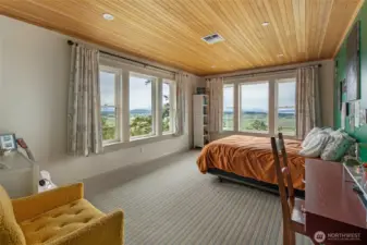 Spacious guest suite with panoramic island and water views, creating a peaceful retreat in the heart of San Juan Island.