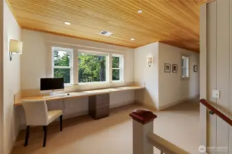 Light-filled upper landing with built-in workspace and flexible use for office, study, or creative space.