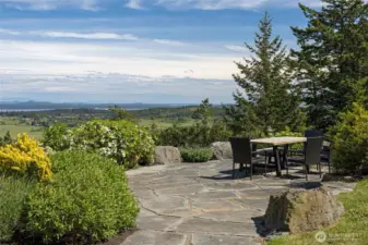 Private stone patio with stunning panoramic views—ideal for outdoor dining, entertaining, or enjoying peaceful island sunsets.