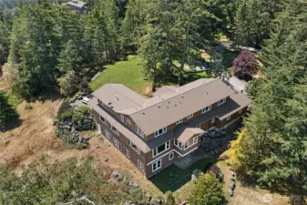 Spacious 5,800 sq ft home surrounded by mature evergreens, offering privacy, tranquility, and classic Pacific Northwest appeal.