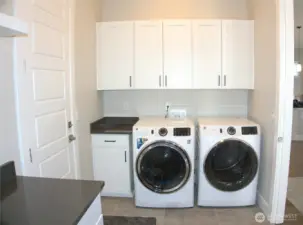 oversized laundry room with great storage