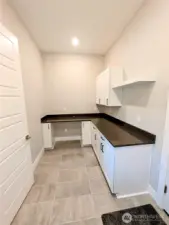 oversized laundry room with tons of storage