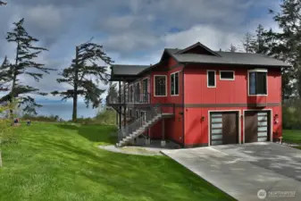 New driveway. Easy access from the deck to the yard—oversized two-car garage.