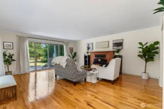 Spacious Living Room with fireplace and slider access to deck