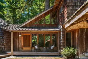 With its metal roof and cedar siding, this home seamlessly blends into the surrounding 20-acre retreat.