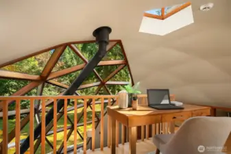 The loft overlooks the central dome and offers a flexible space—perfect for a home office, reading nook, or cozy den—your choice!