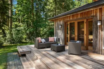 Spacious deck off the living room wraps around to the front entry—perfect for relaxing, entertaining, or soaking in the surrounding views.