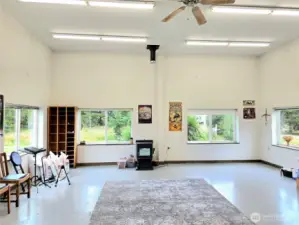 Studio full of windows & pellet stove