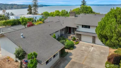 Home has a very long driveway in addition to a roundabout driveway