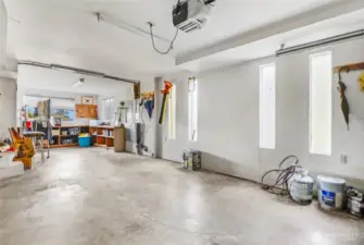View of the side of the garage with the tandem/shop space