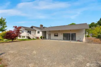 View of the side of the home and behind the guest home/unit