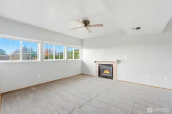 Downstairs rec room is spacious, bright and open with a gas fireplace and wet bar!