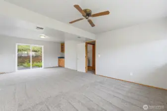 Another view of the rec room, with slider to back yard and wet bar.