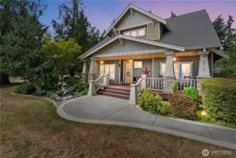 Magnificent street appeal with the Classic Craftsman looks and a waterfall and oversized front porch to greet you