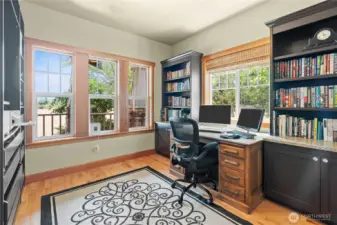 To the left of the entry is the den....filled with light this is a wonderful work from home space