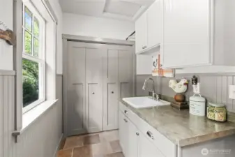 Mudroom off of the back patio is the perfect place to leave the world behind as you walk into your home