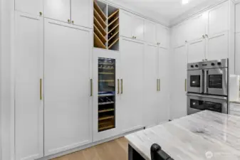 Hidden "Butler Pantry" access. Freezer on left, wine fridge in the middle and Refer on the right.