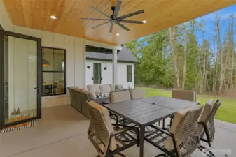 A Wall of Windows open (on tracks) to the covered patio.