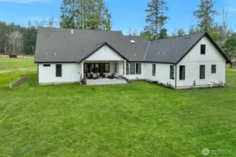 Landscaping not complete... Seller was going to install a custom patio around the covered patio.