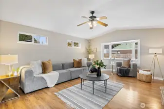 This family room was an addition. The openness to the kitchen and a slider leading to the back deck, make a great entertaining space.