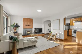 Basement living room with its own entrance and wood burning fireplace