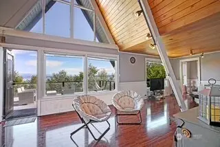 Soaring ceilings and walls of windows...w/views galore from each and every room!