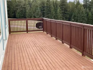 large deck on 3 sides of home