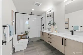 Modern master bathroom with a double vanity and a walk-in glass shower for a spa-like experience.