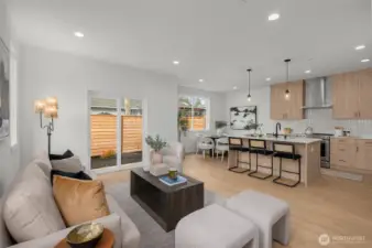 Let the sunshine in. The open-concept living, dining, and kitchen space is an entertainer’s dream—decked out in luxe finishes and surrounded by windows that flood it all with natural light.